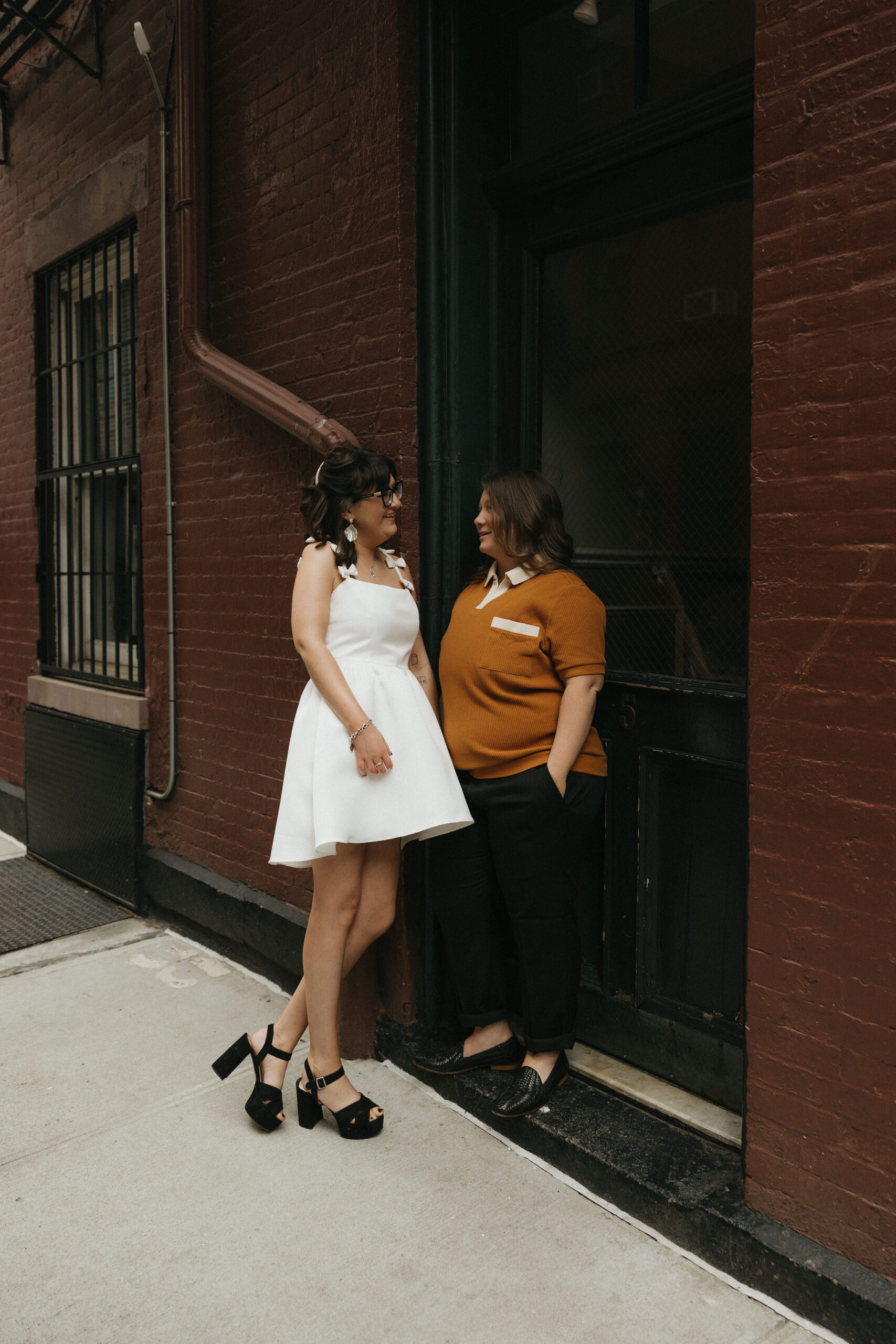 Newly engaged couple at Cornelia Street posing for their personalized engagement photos