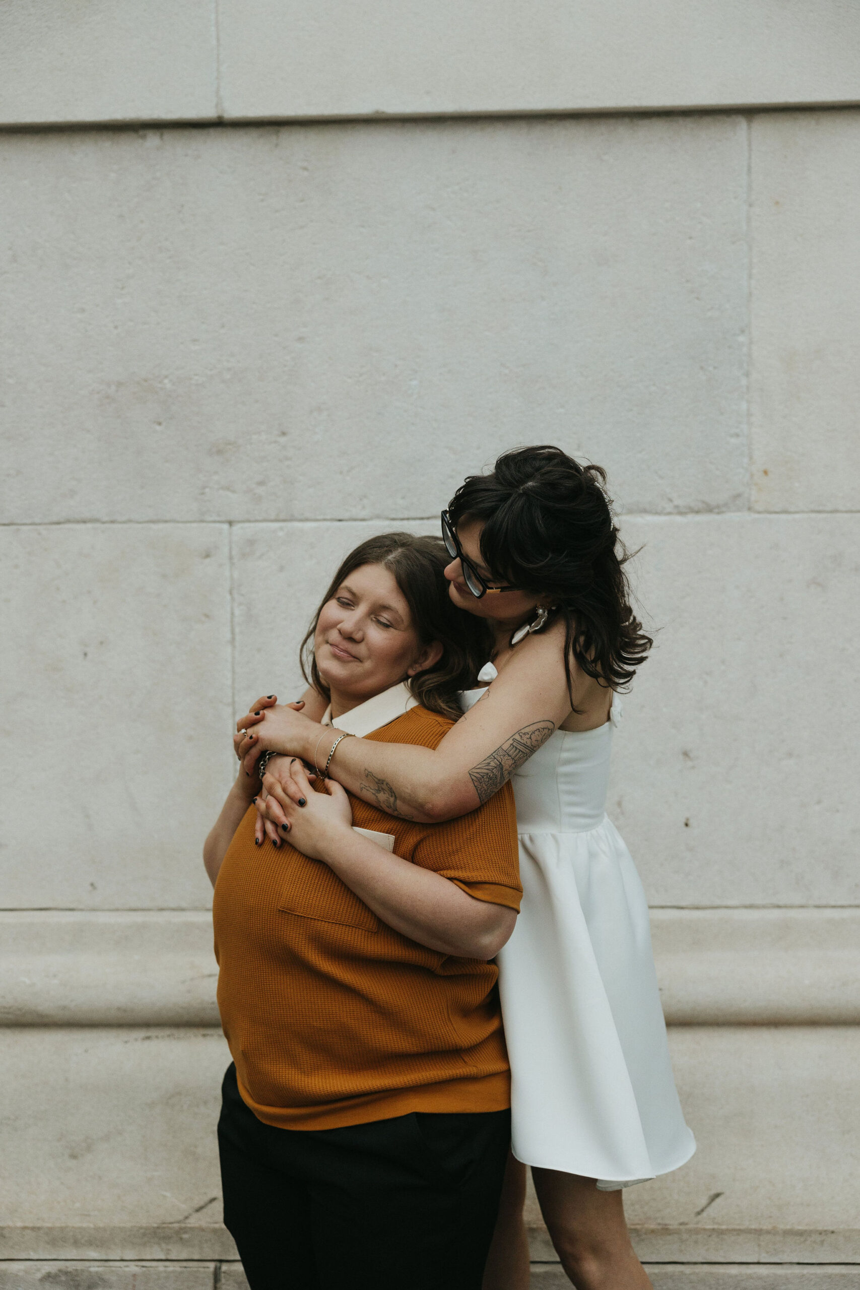 Newly engaged couple embracing eachother for their personalized engagement photos