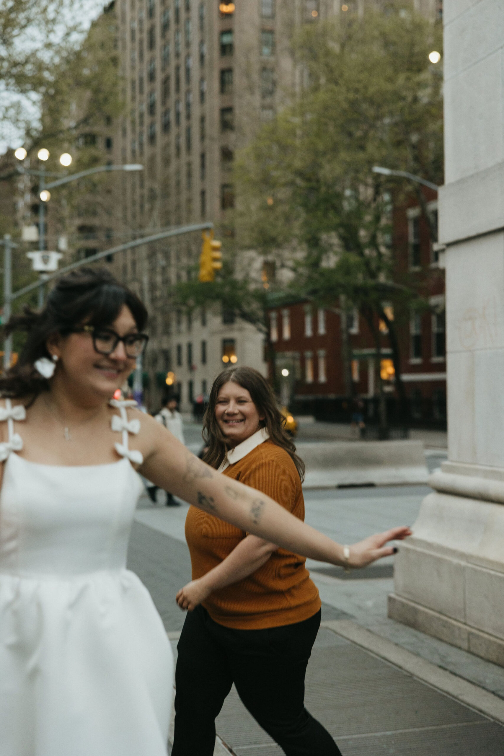 Newly engaged couple dancing in the streets of New York