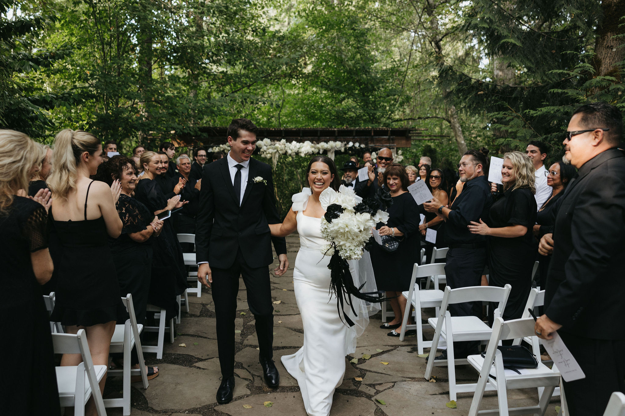 Bride and groom walking up the wedding ceremony aisle after their wedding ceremony at Maroni Meadows wedding venue