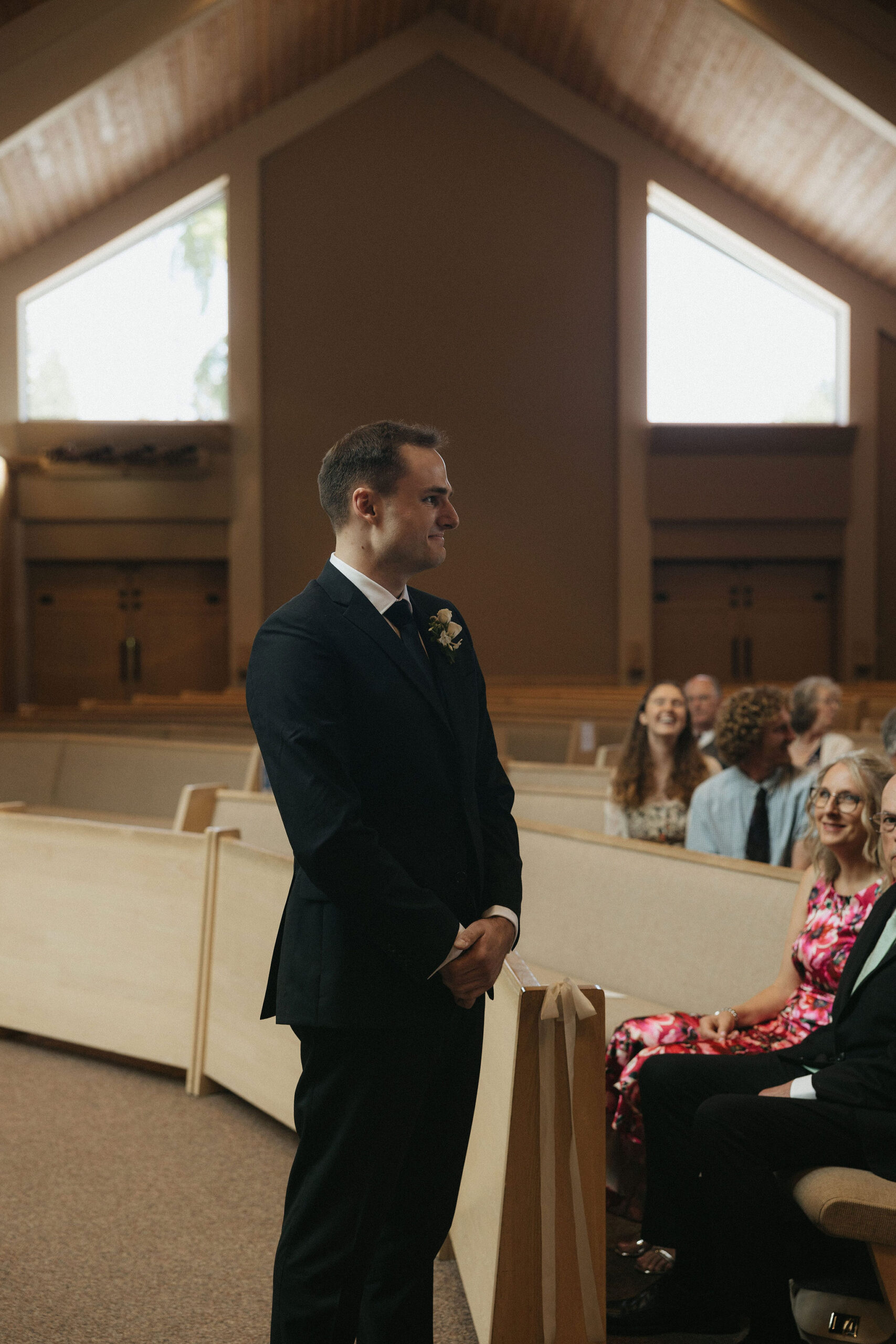 Groom tearing up as his bride walks down the aisle