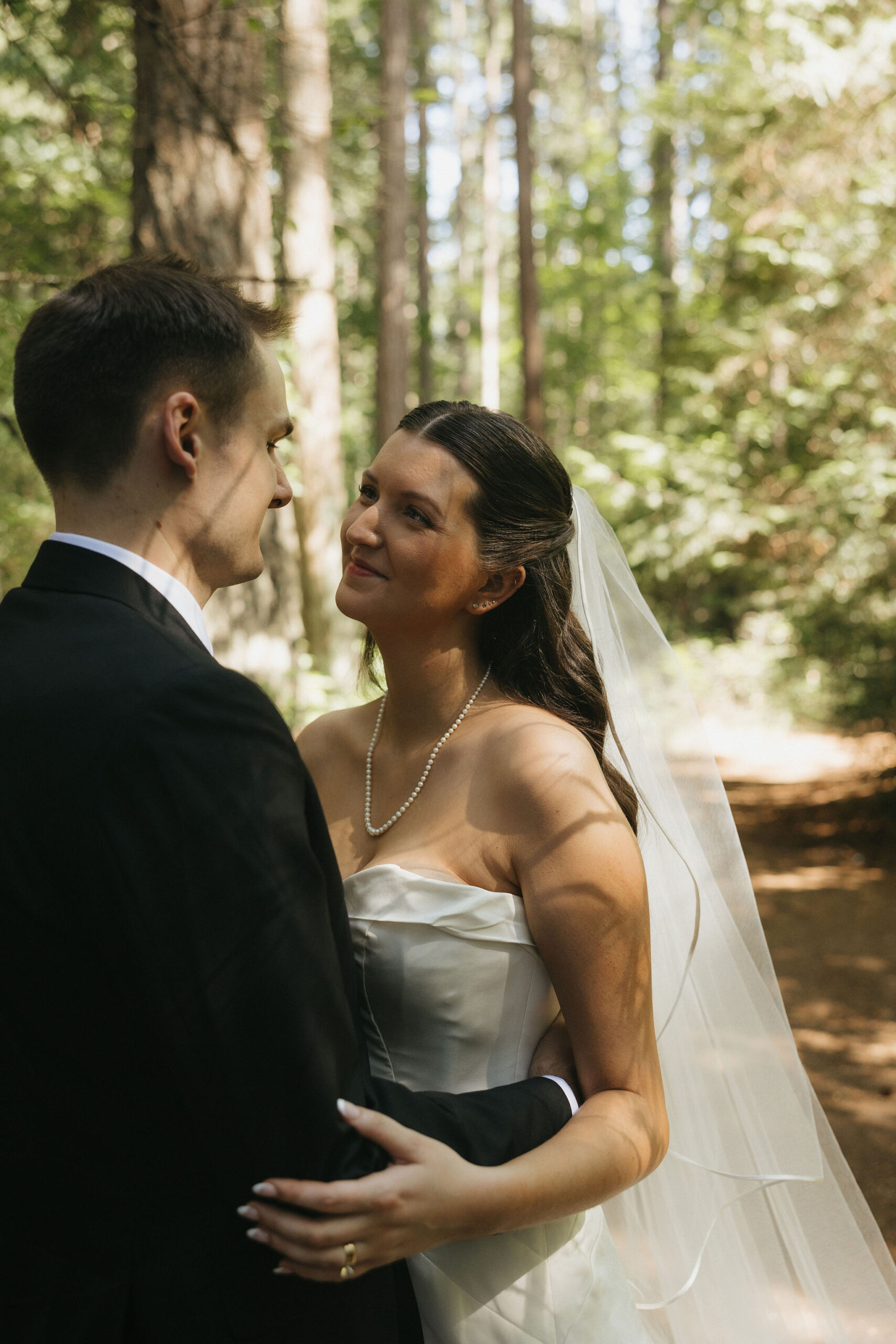 Bride and groom gazing into eachothers eyes smiling