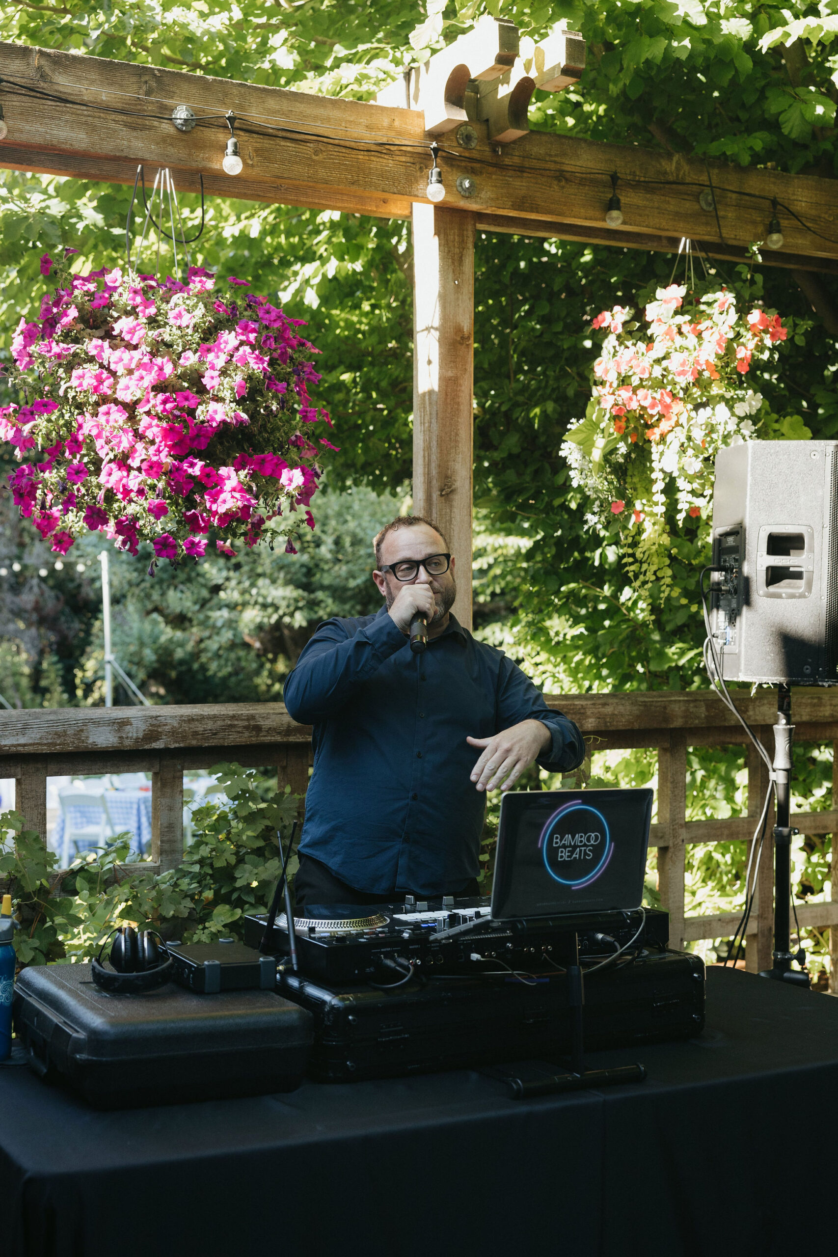 DJ speaking through a microphone at the wedding reception