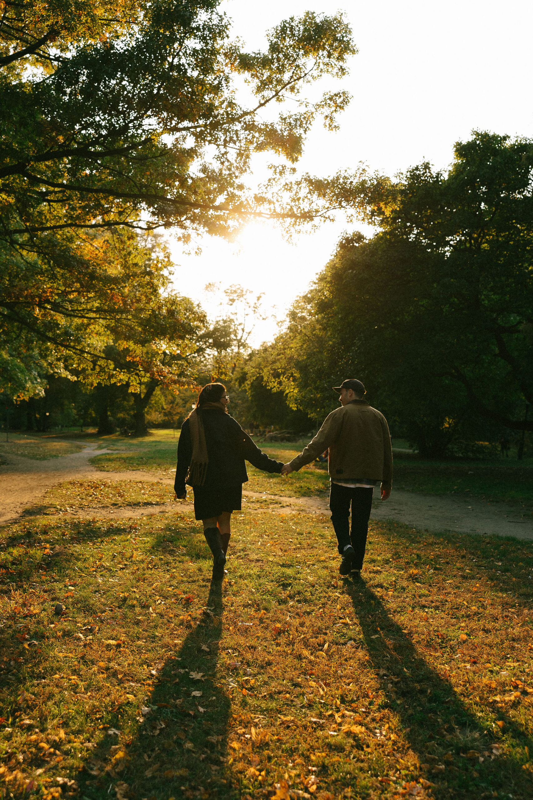 Greenpoint Loft Wedding sunset scene with the couple walking hand in hand through a park, enjoying the golden hour.





